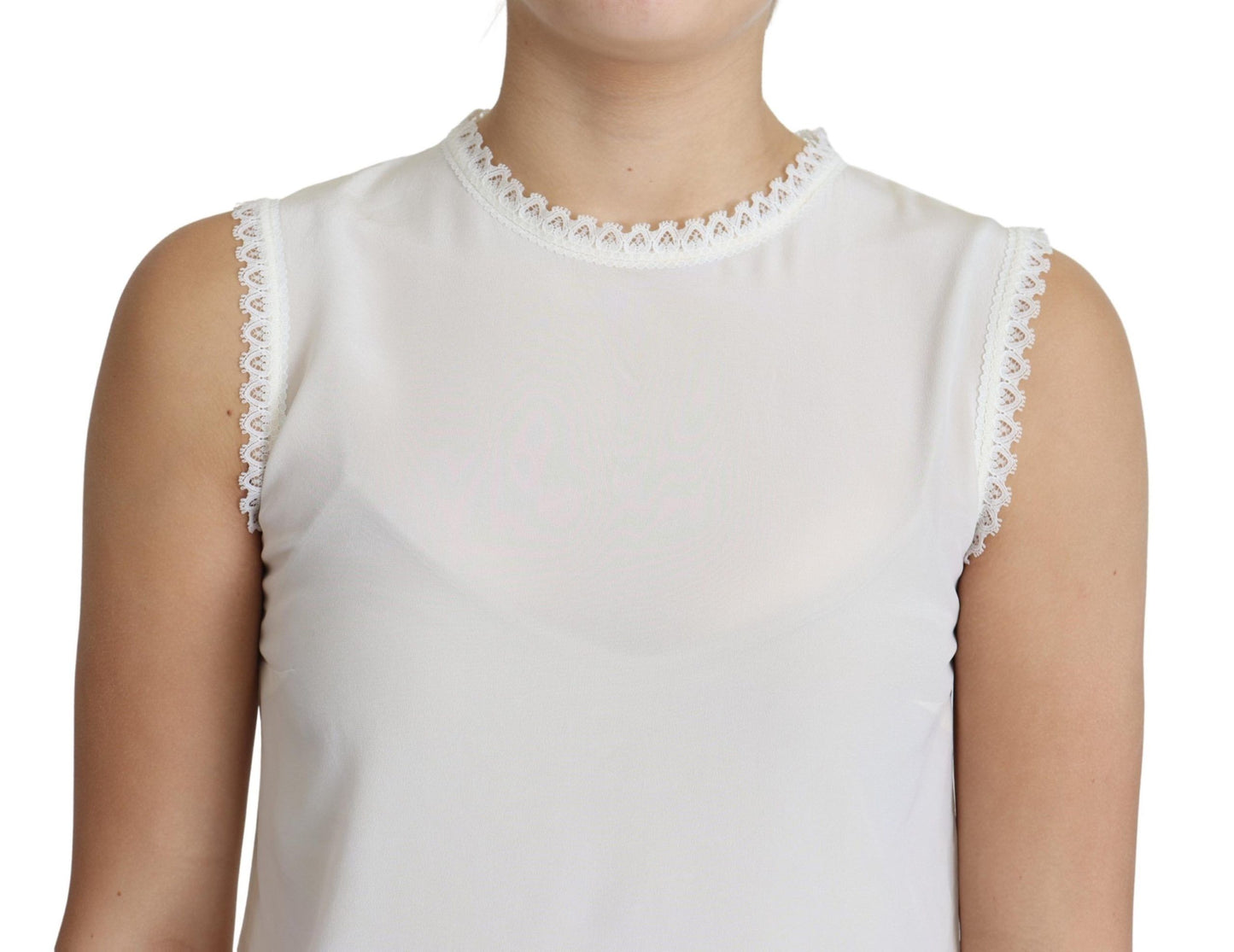 Blouse blanche Dolce & Gabbana en soie, avec empiècements en dentelle, sans manches.