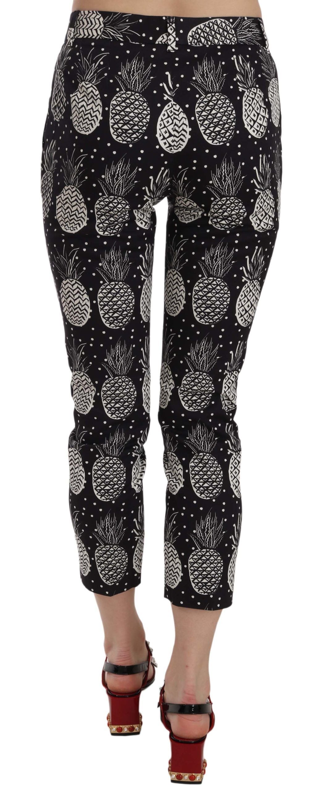 Dolce & Gabbana zwarte, aansluitende capri broek met ananasprint.