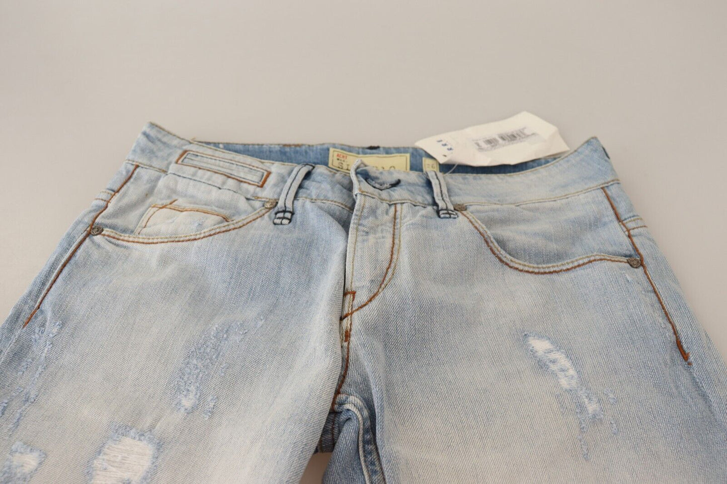 Pantalon en jean Acht, bleu clair, effet usé, en coton, avec revers au bas.