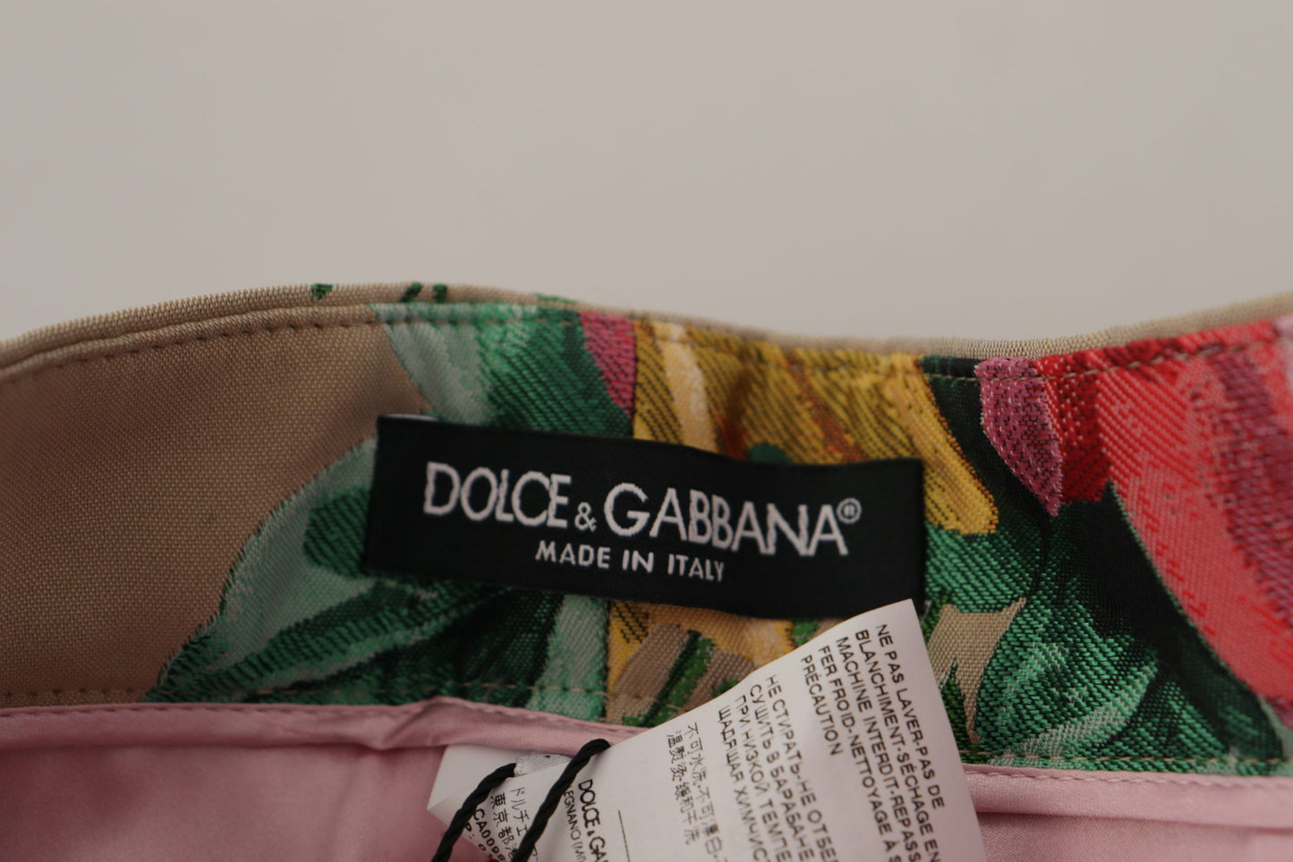 Dolce & Gabbana beige jurk met bloemenprint, formele broek met hoge taille.