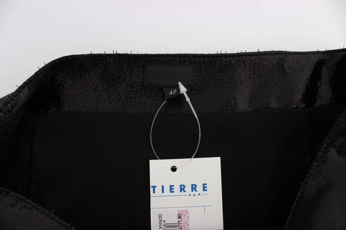 Jupe droite en laine et soie noire, au-dessus du genou, de la marque Exte.