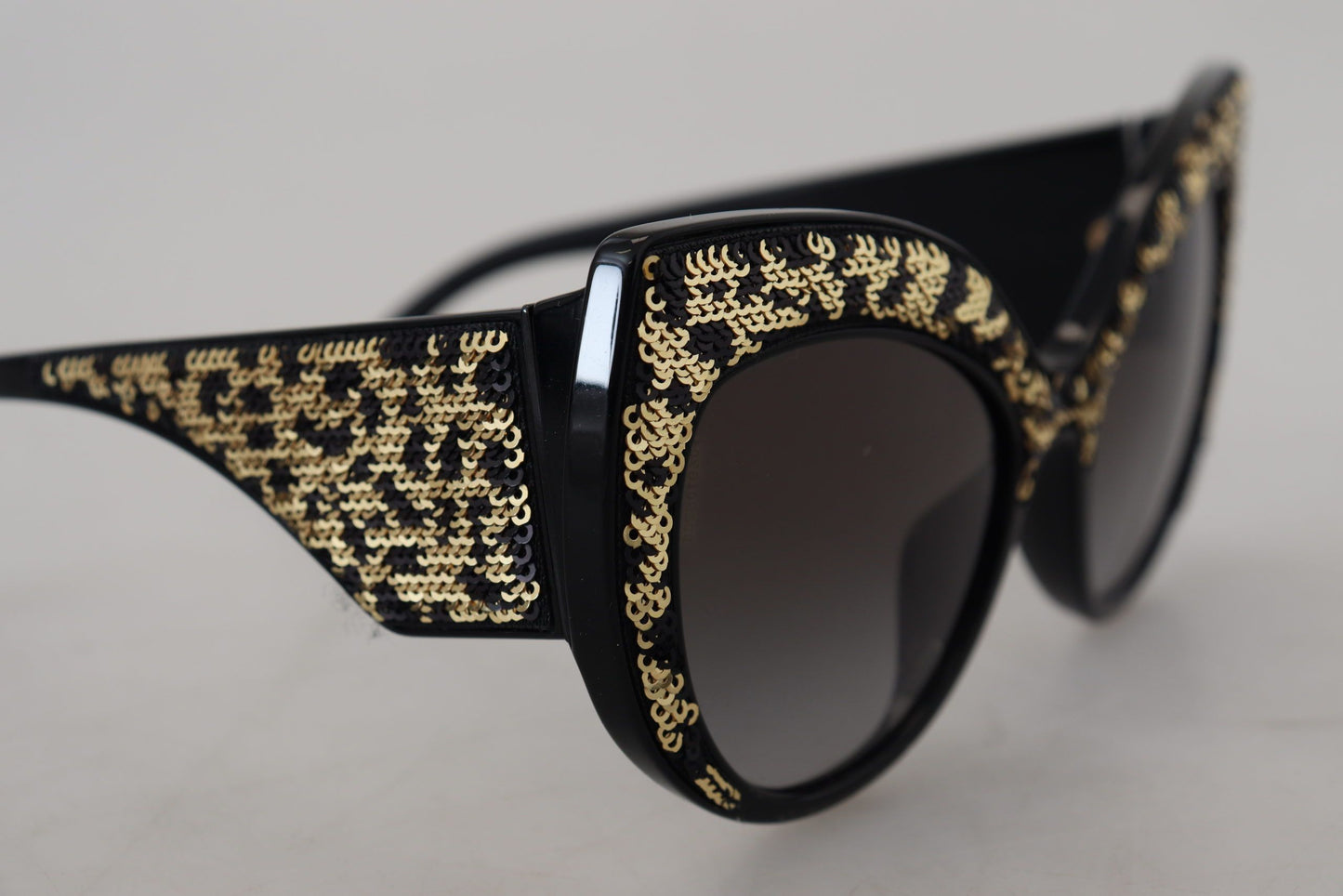 Lunettes de soleil papillon polarisées Dolce & Gabbana noires et dorées à paillettes DG4326