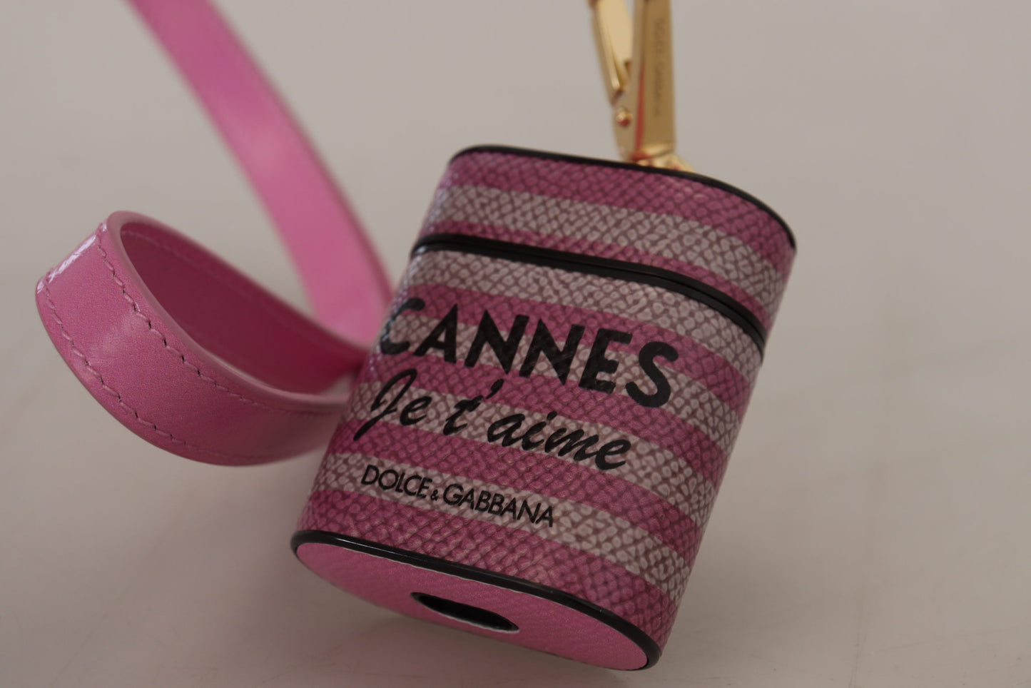 Étui pour Airpods Dolce & Gabbana avec bracelet en cuir rose et noir et logo en métal doré
