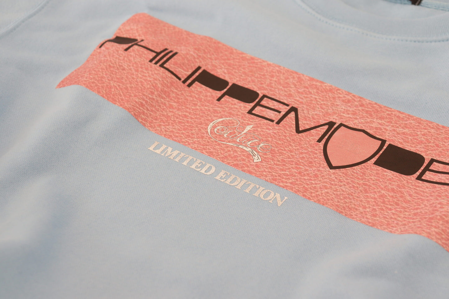 Pull à manches longues bleu clair avec logo imprimé de Philippe Model