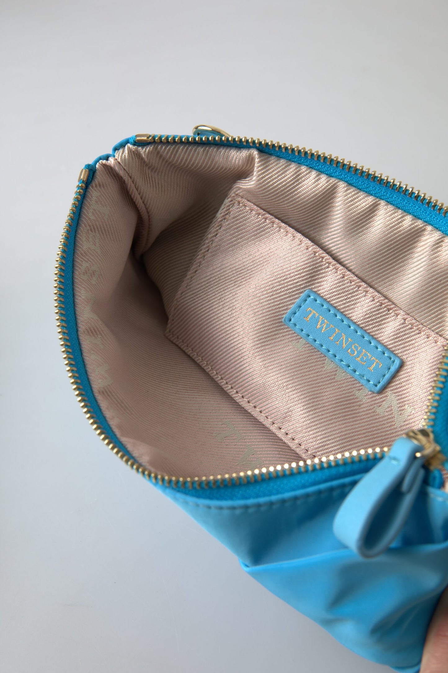 Pochette Twinset en tafta bleu et soie avec grand nœud et fermeture éclair pour femme, sac à logo Borse
