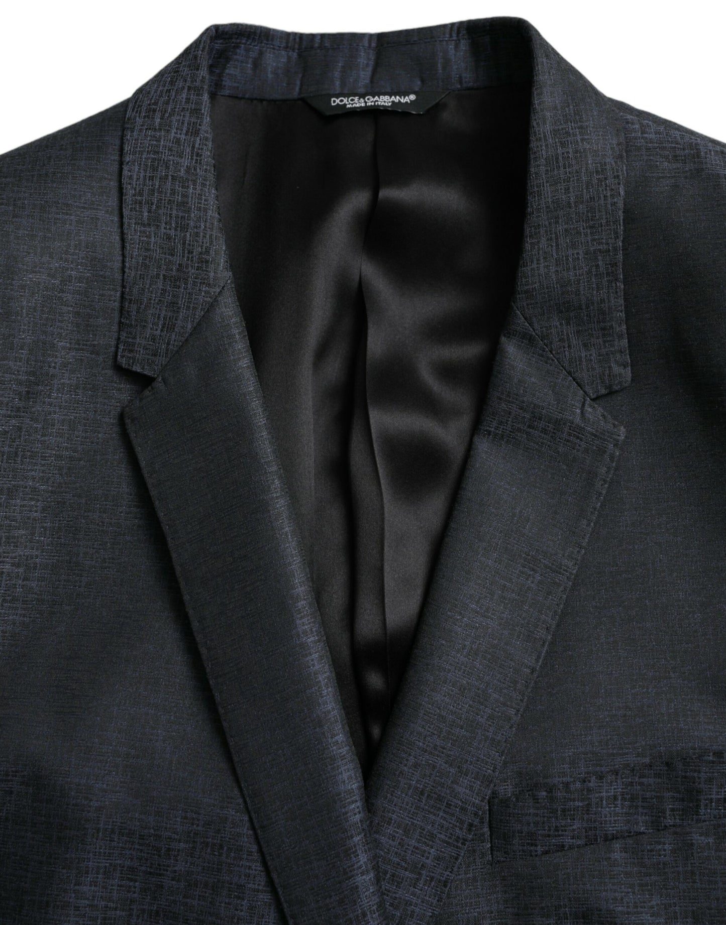 Dolce & Gabbana, veste-blazer bleu en laine, boutonnage simple, dorée.