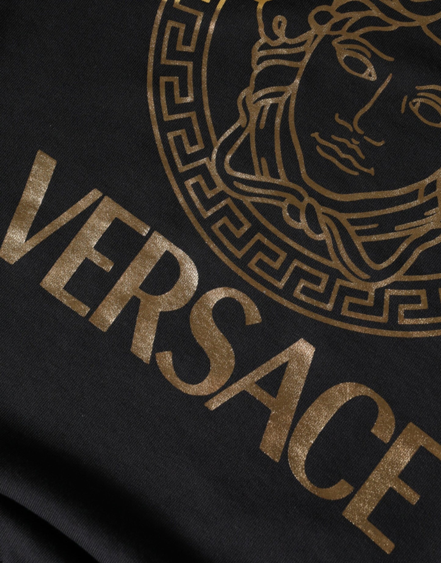 Pull en coton à col rond en molleton Versace noir avec tête de Méduse.