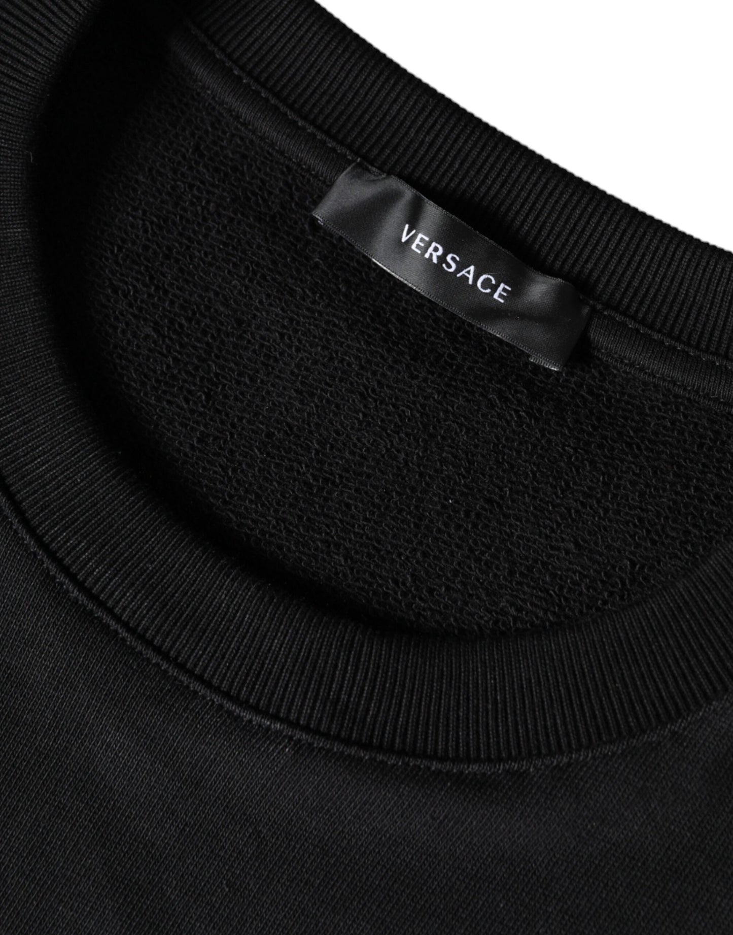 Pull en coton à col rond en molleton Versace noir avec tête de Méduse.