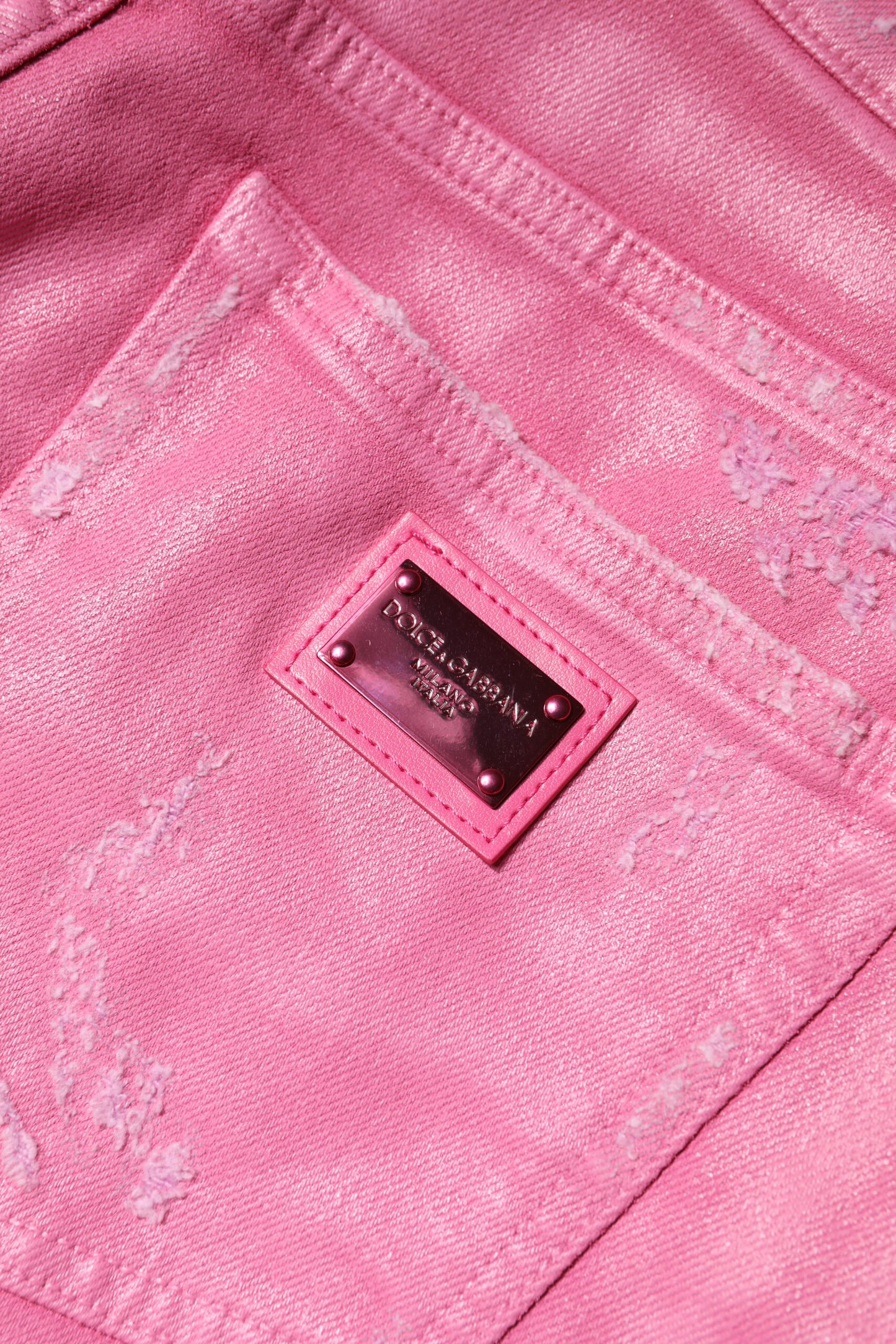 Dolce & Gabbana roze, versleten, taps toelopende jeans met hoge taille.