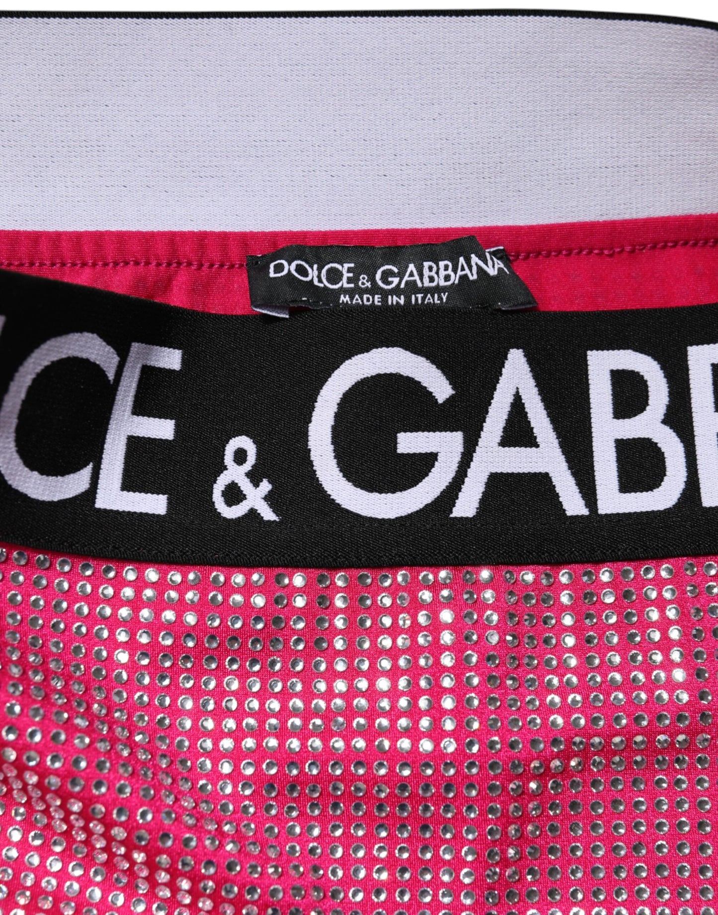 Jupe mini Dolce & Gabbana rose avec logo et strass.