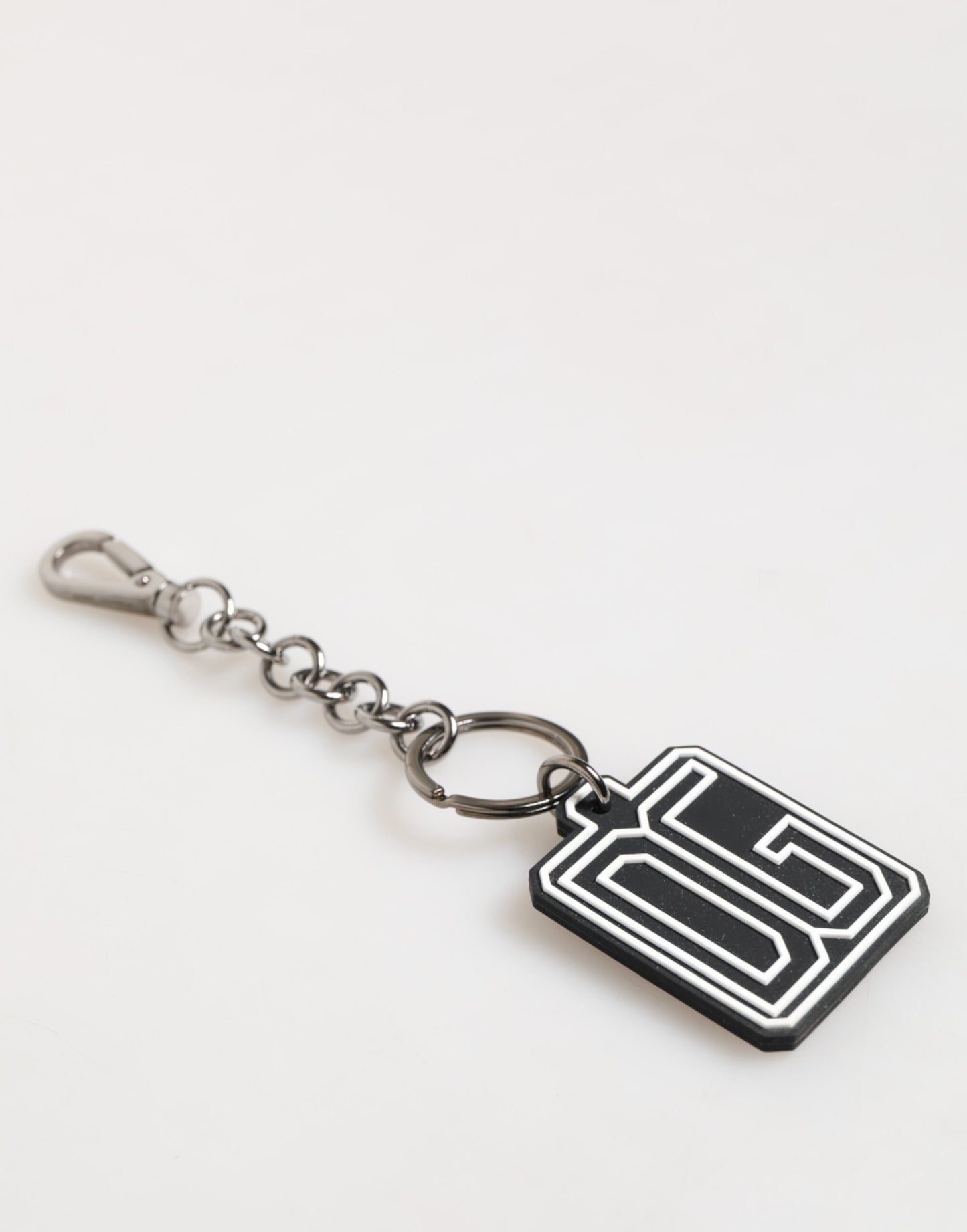 Porte-clés Dolce & Gabbana pour homme, noir et blanc, avec logo DG en caoutchouc argenté