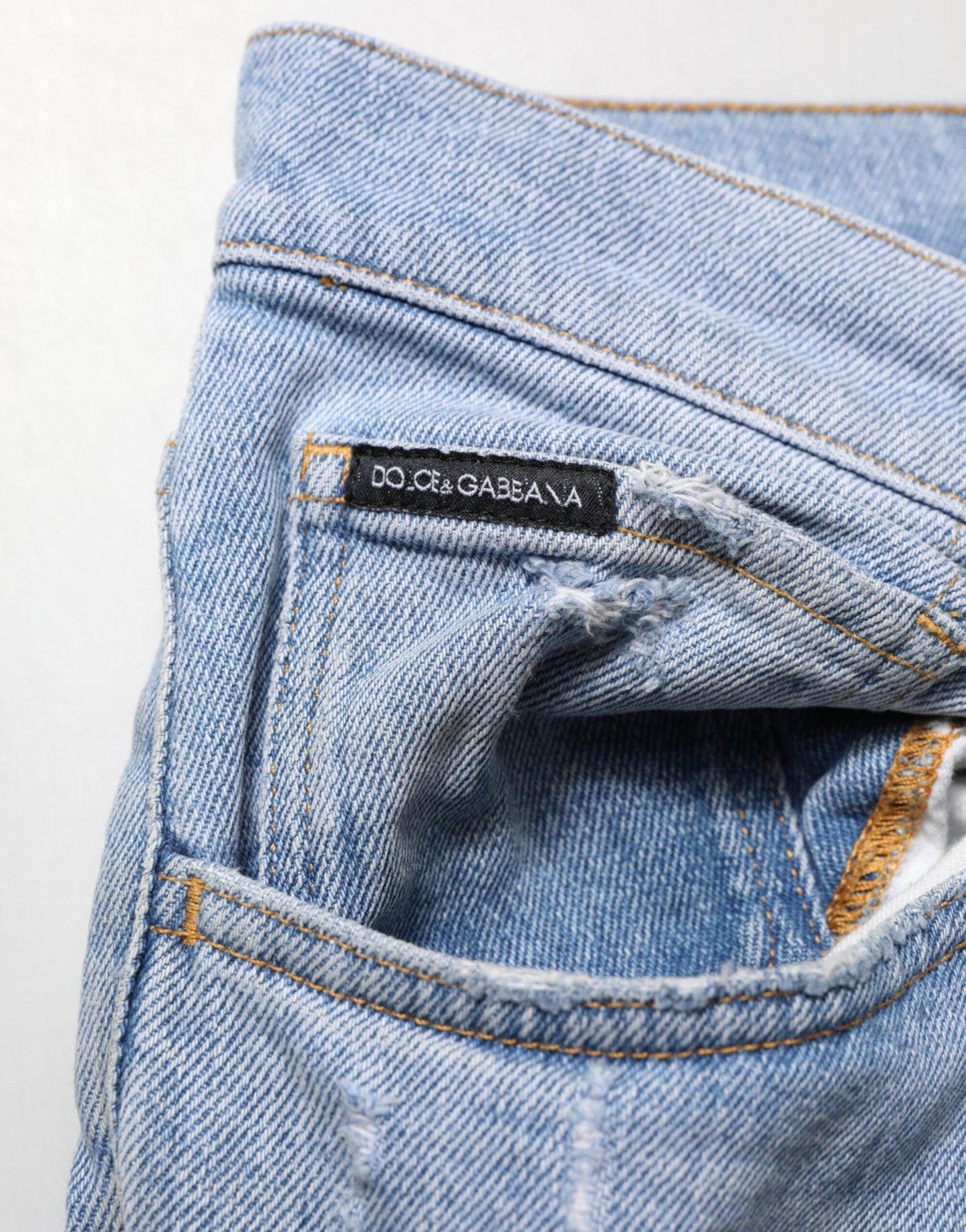 Jeans en jean slim à effet délavé en coton bleu de Dolce & Gabbana