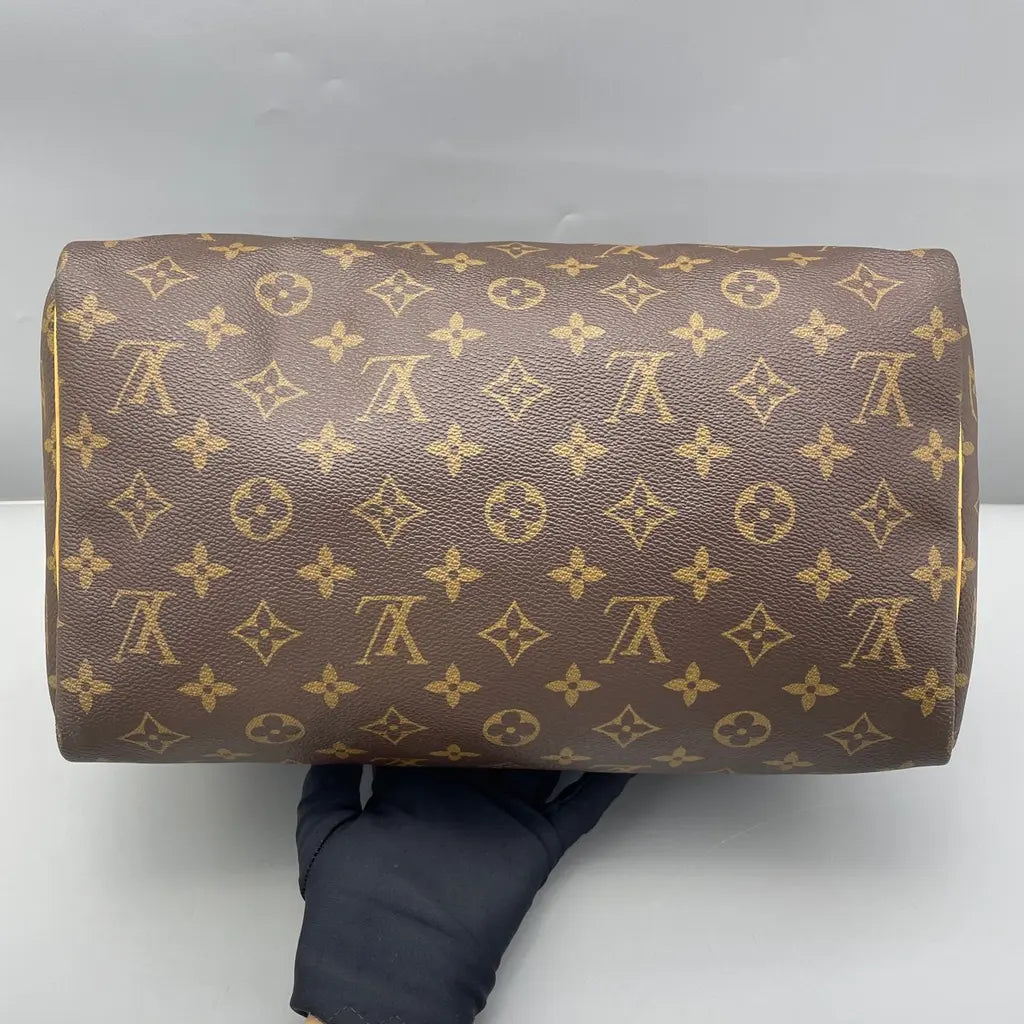 Sac à main d'occasion en cuir Louis Vuitton Speedy - bon état - Chakmar Luxe