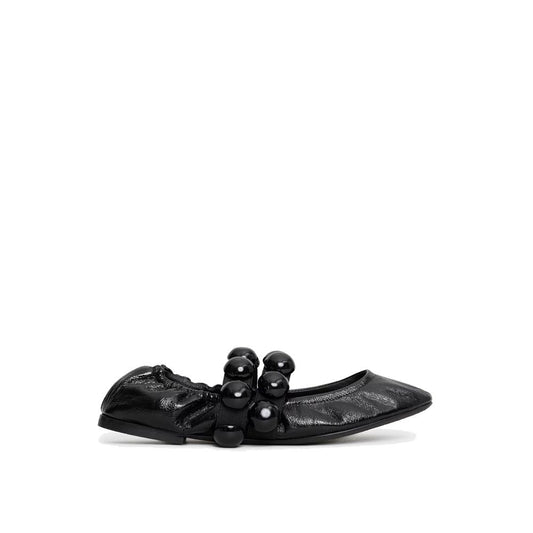 Mocassins Alaïa en cuir de veau noir