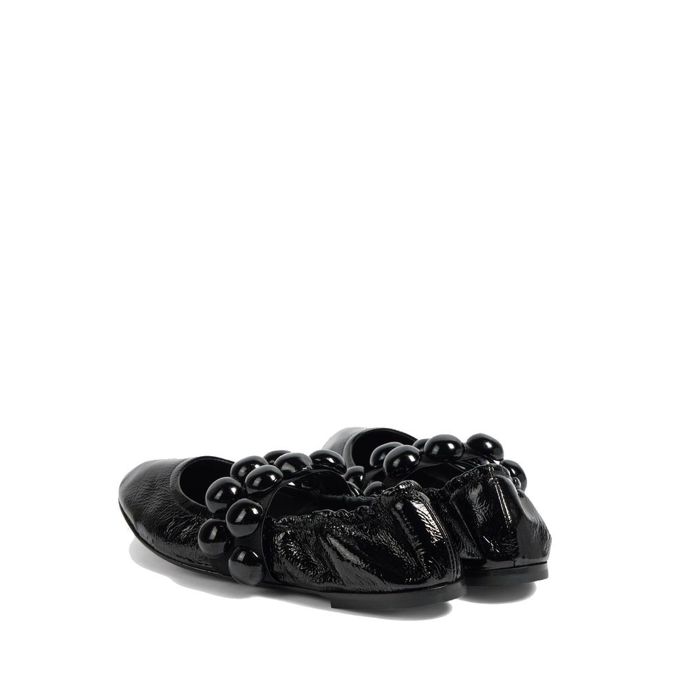 Mocassins Alaïa en cuir de veau noir