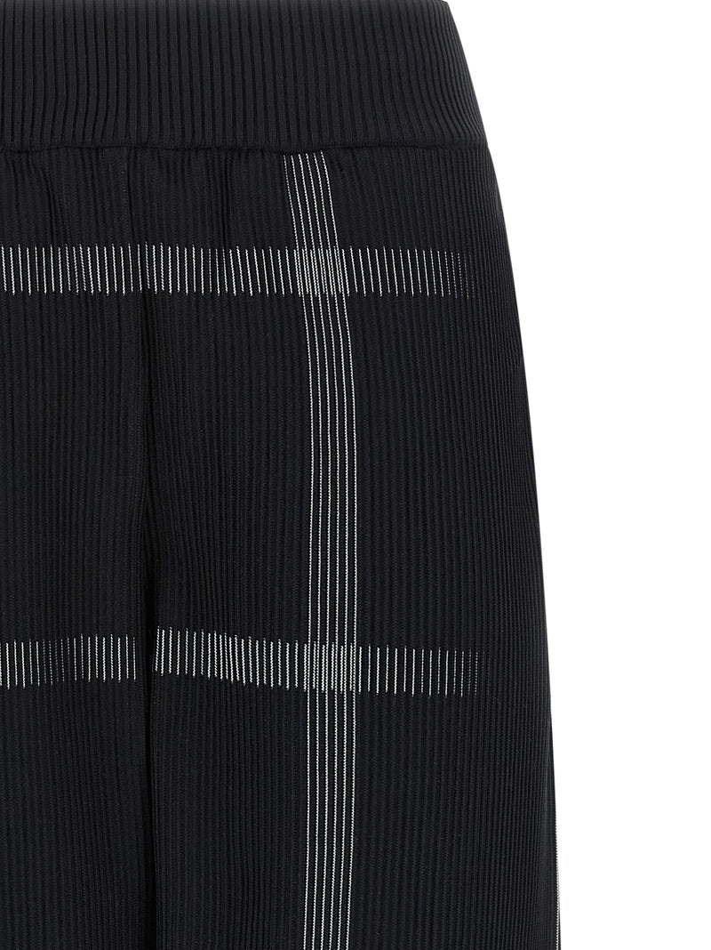 PLEATS PLEASE ISSEY MIYAKE Pantalon décontracté noir en polyester