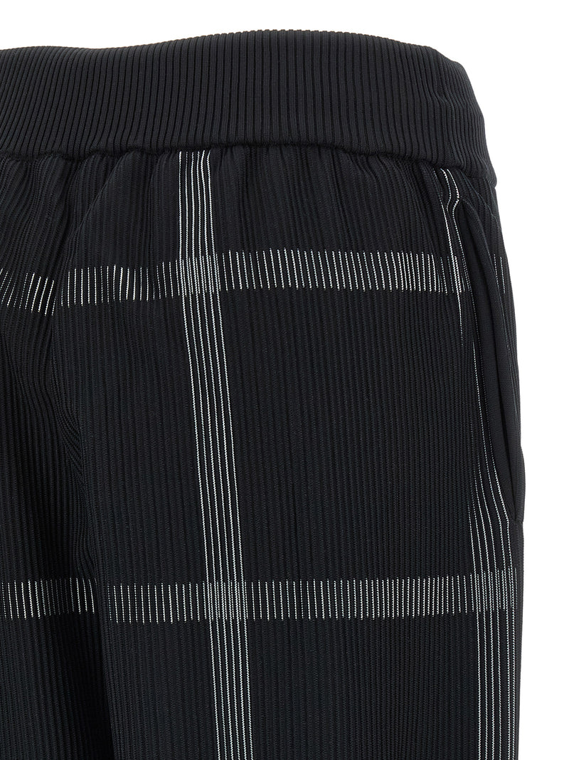 PLEATS PLEASE ISSEY MIYAKE Pantalon décontracté noir en polyester