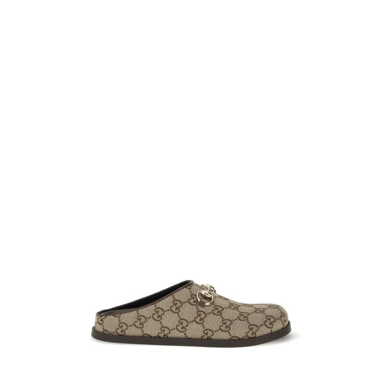 Mules en caoutchouc beige Gucci