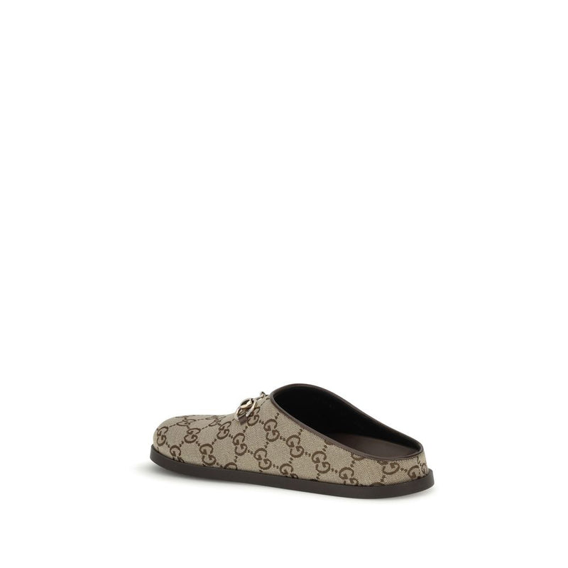 Mules en caoutchouc beige Gucci