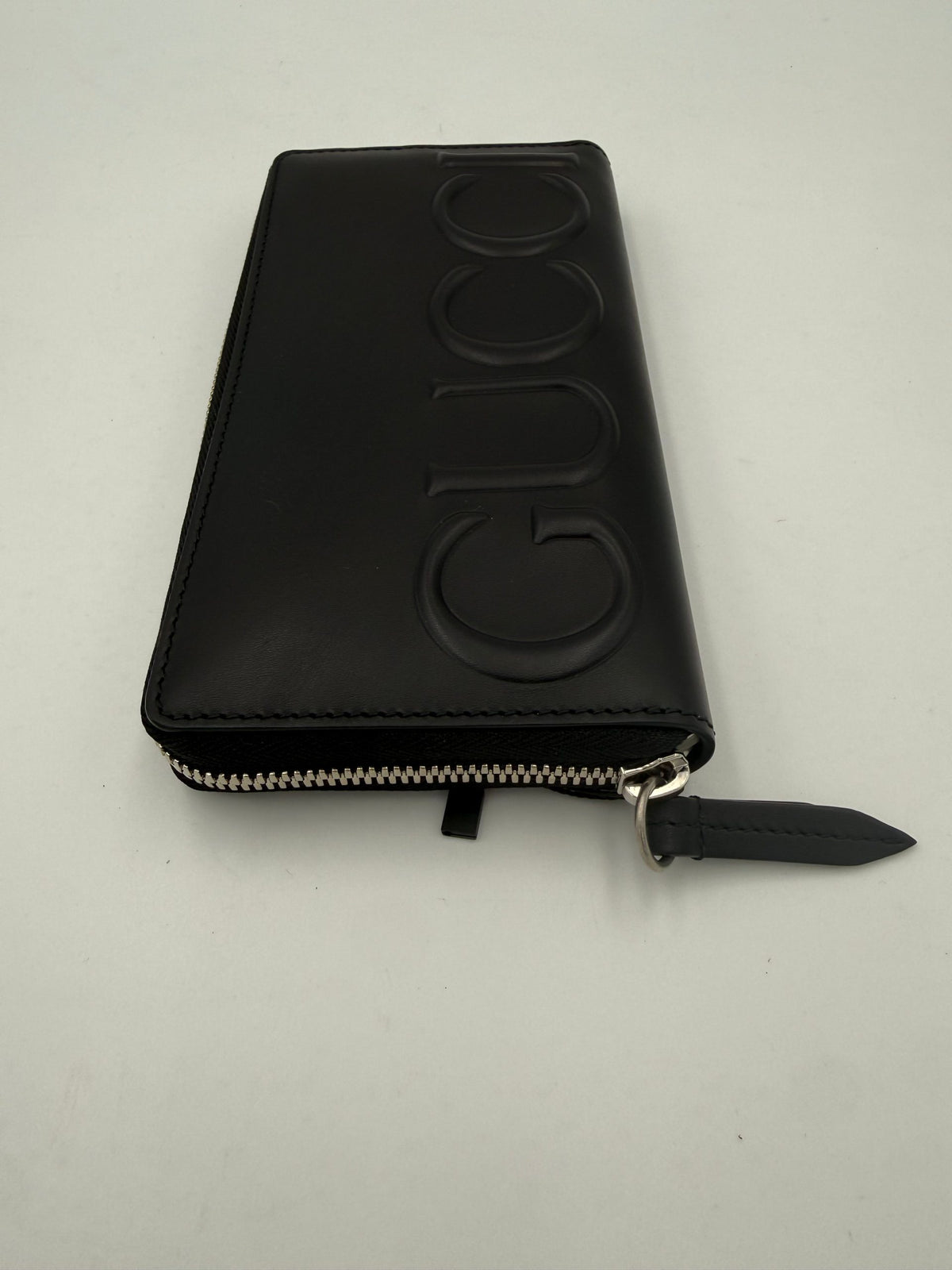 Portefeuille zippé Gucci GUCCI noir avec logo estampé sur le devant