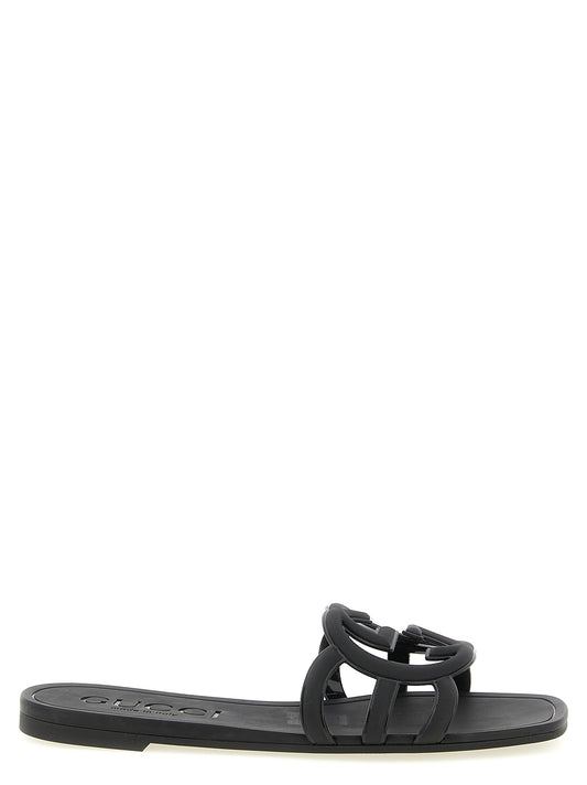 Mules en caoutchouc noires Gucci