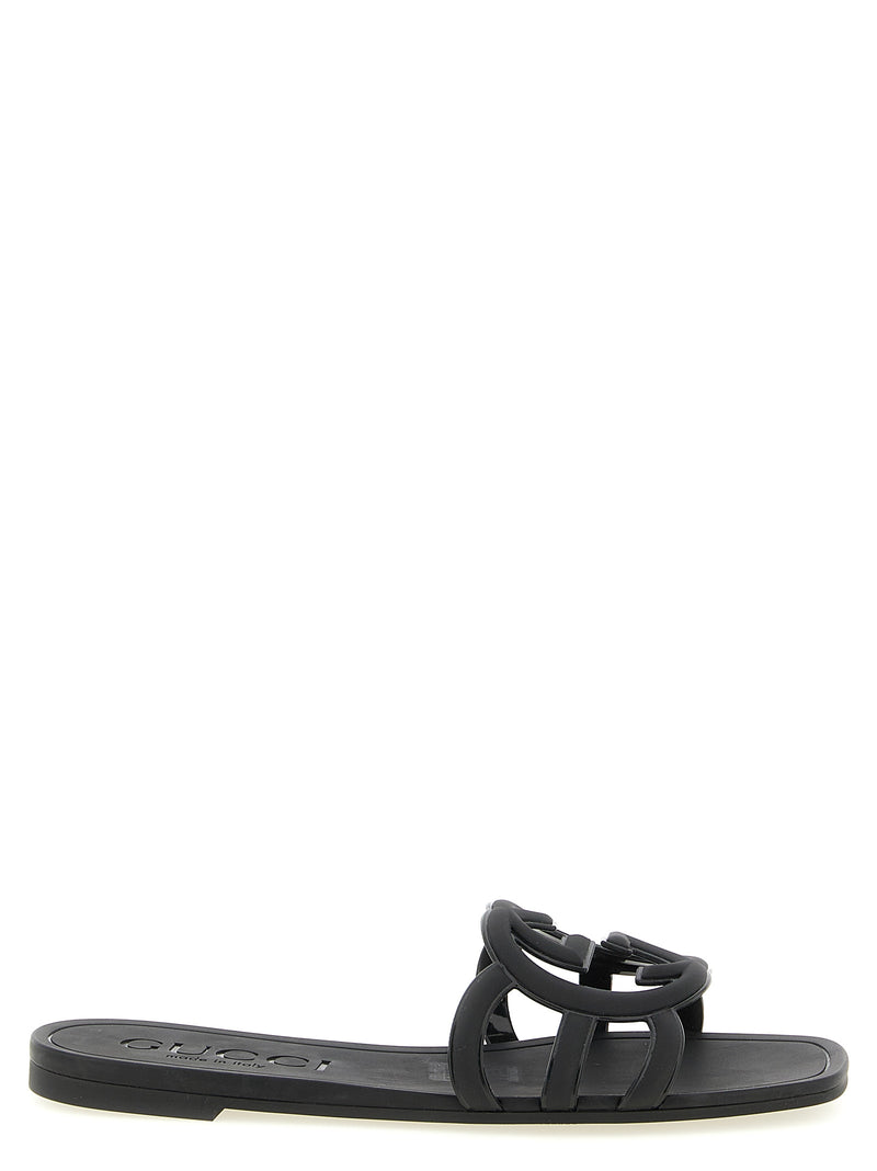 Mules en caoutchouc noires Gucci