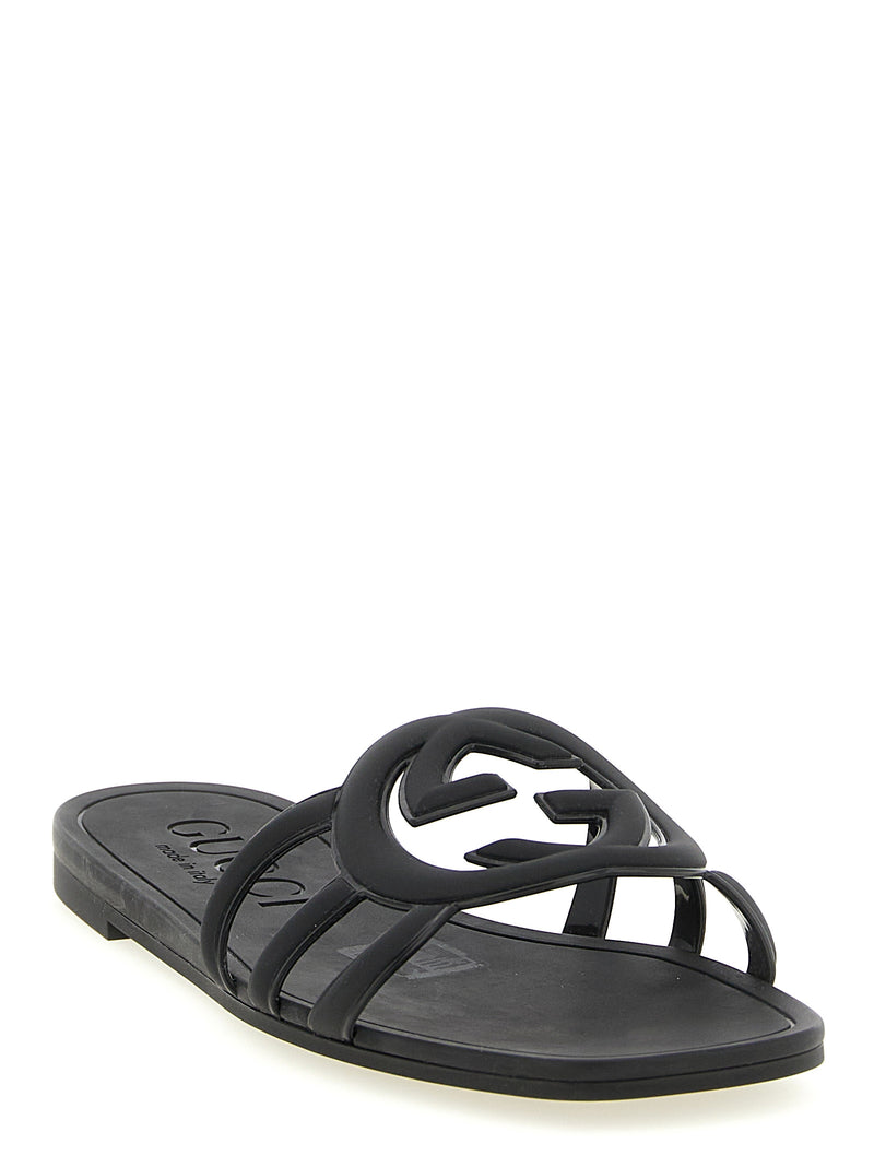Mules en caoutchouc noires Gucci