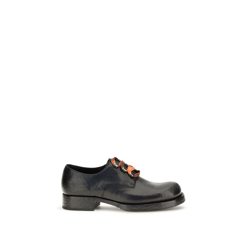 Prada Chaussures basses en cuir de veau noir Bos Taurus