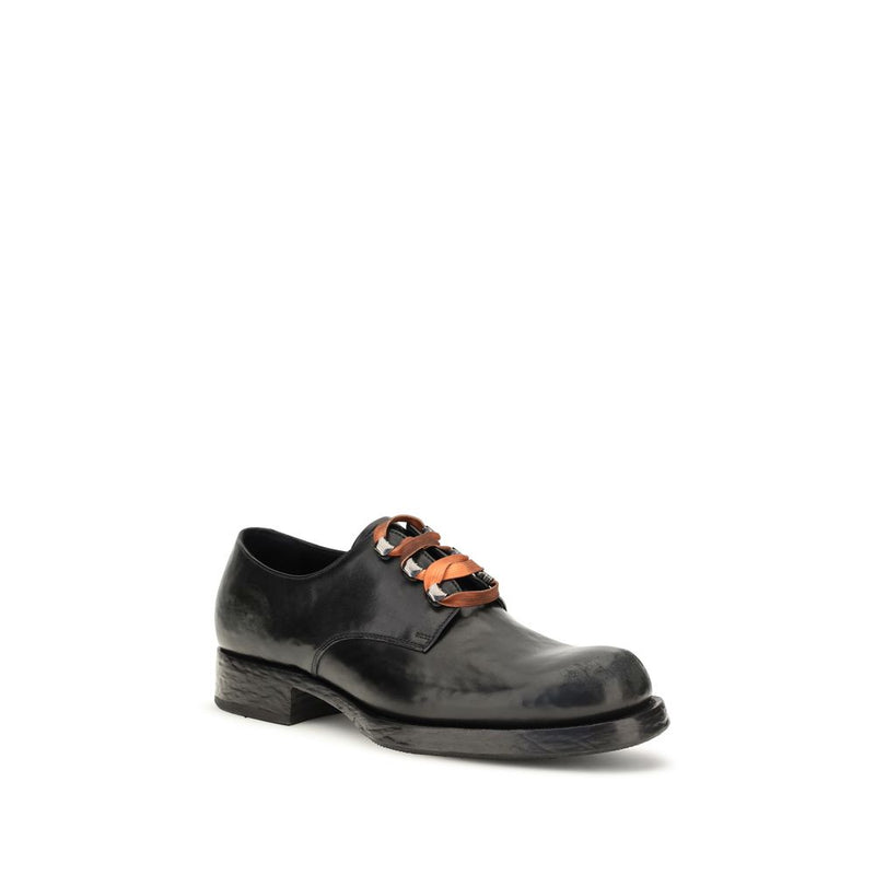 Prada Chaussures basses en cuir de veau noir Bos Taurus