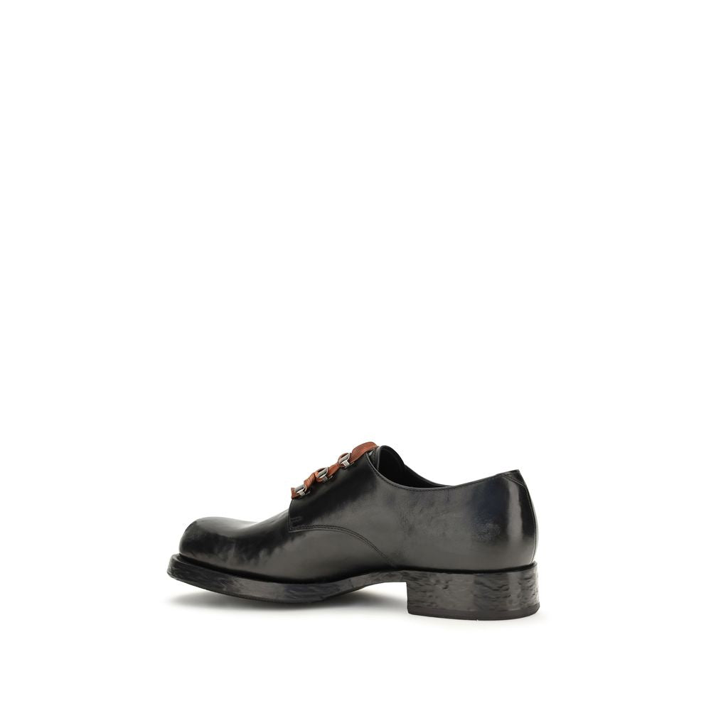 Prada Chaussures basses en cuir de veau noir Bos Taurus