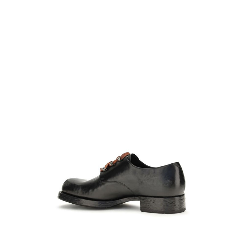 Prada Chaussures basses en cuir de veau noir Bos Taurus