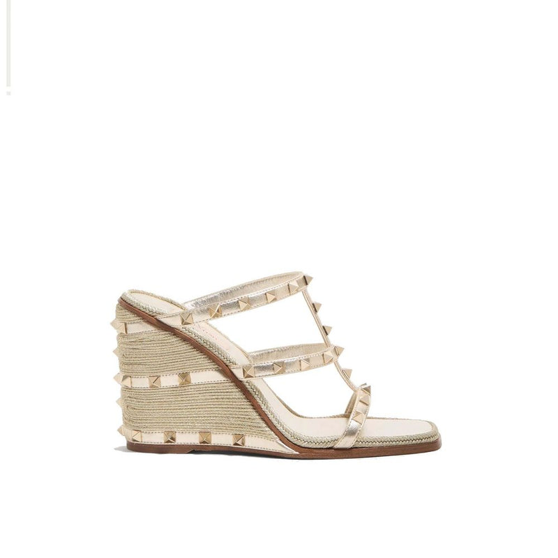Mules en cuir de veau doré Valentino Garavani