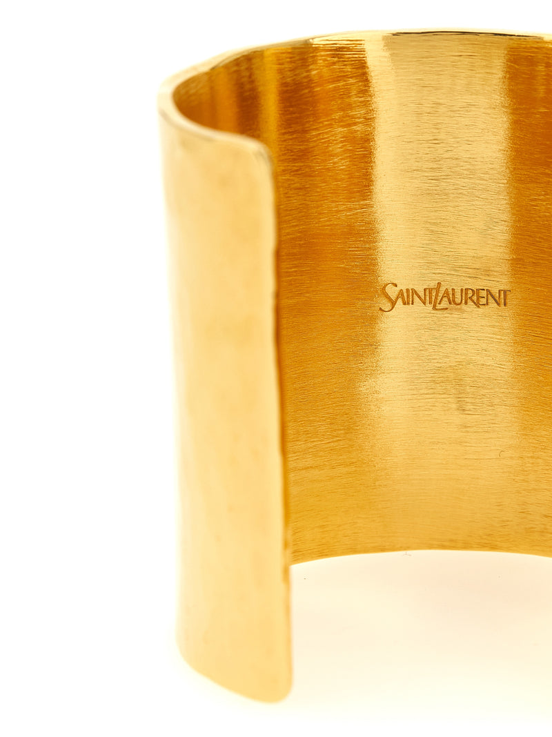 Bracelet en laiton doré Saint Laurent avec logo Cassandre