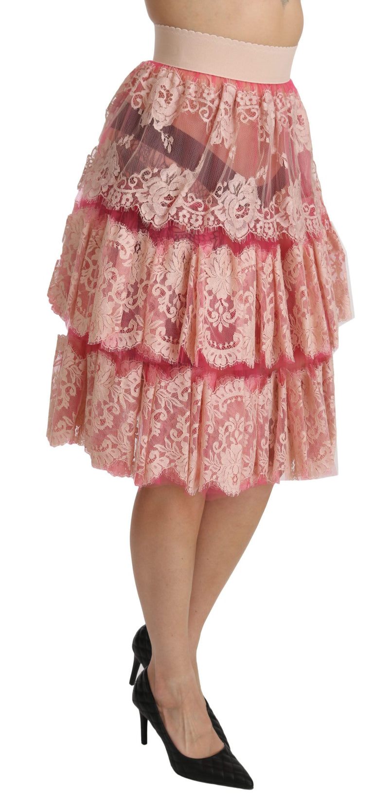 Jupe mi-longue rose en dentelle à plusieurs épaisseurs, taille haute, Dolce &amp; Gabbana.