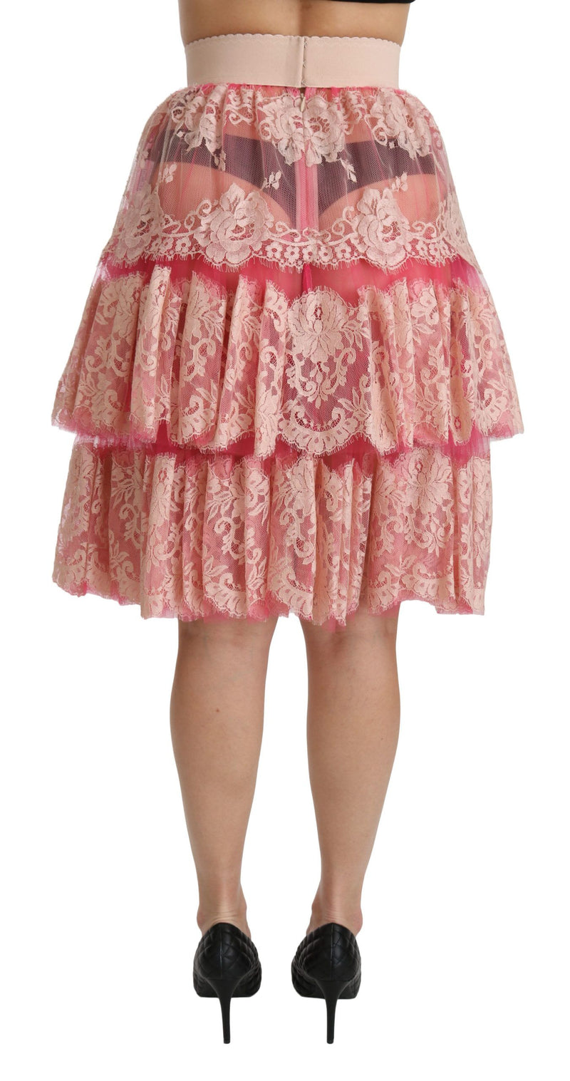 Jupe mi-longue rose en dentelle à plusieurs épaisseurs, taille haute, Dolce &amp; Gabbana.