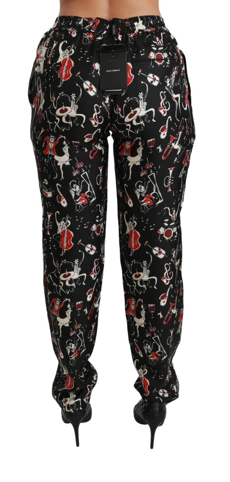 Pantalon mi-hauteur en soie noire à motifs instrumentaux de Dolce &amp; Gabbana