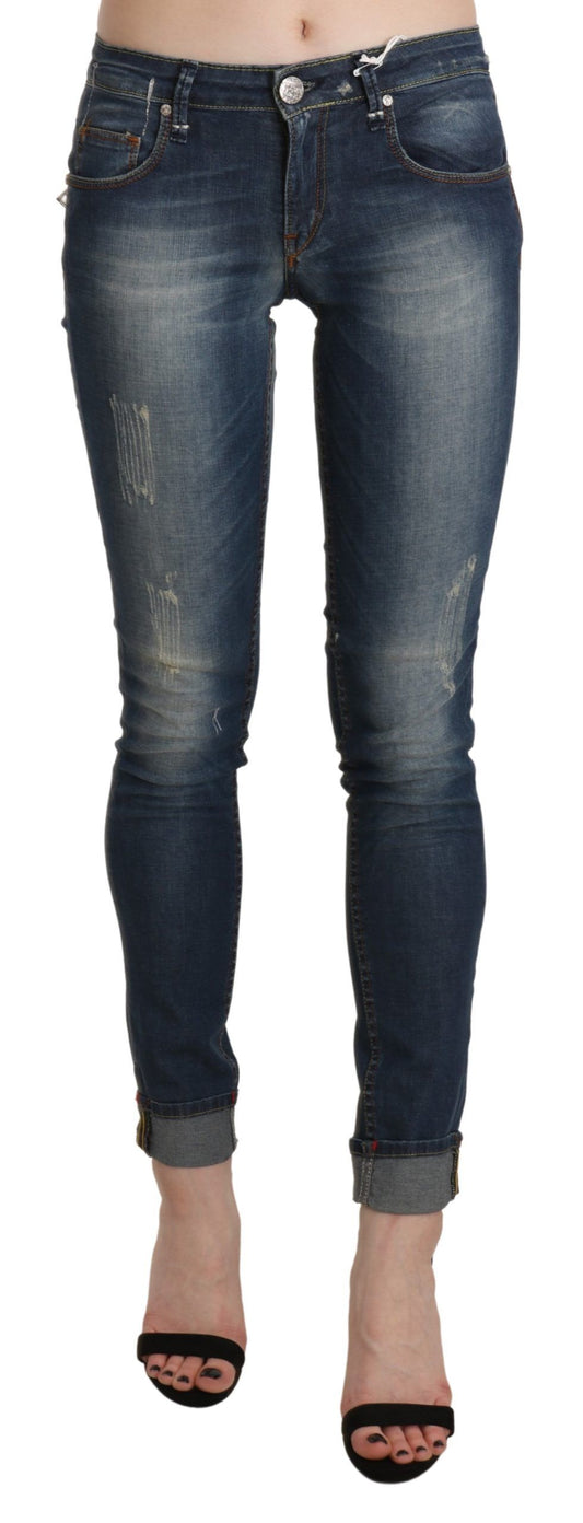 Pantalon en jean skinny taille basse, effet délavé bleu, taille courte.