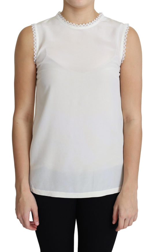 Blouse blanche Dolce & Gabbana en soie, avec empiècements en dentelle, sans manches.