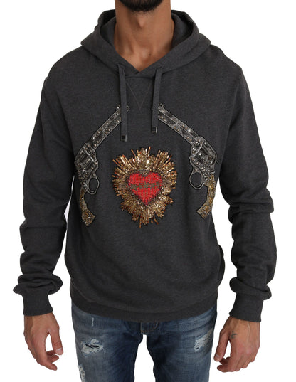 Pull gris à capuche Dolce & Gabbana avec cœur rouge en cristal et motif pistolet.