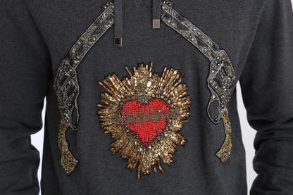 Pull gris à capuche Dolce & Gabbana avec cœur rouge en cristal et motif pistolet.