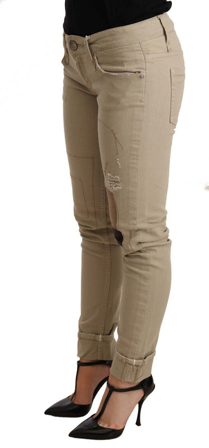 Pantalon slim en coton denim beige à jambes pliées Acht