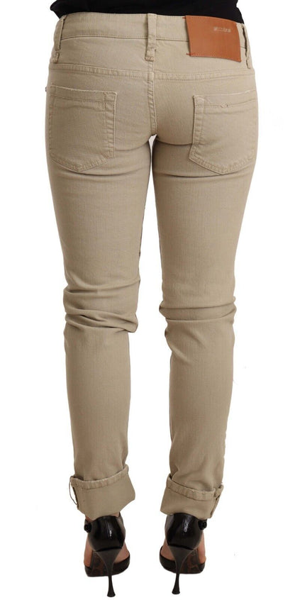 Pantalon slim en coton denim beige à jambes pliées Acht