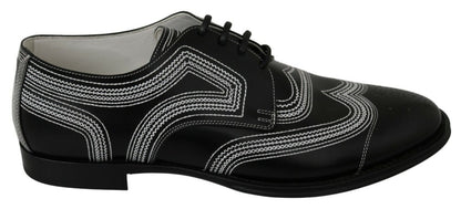 Chaussures habillées en cuir noir, style derby, avec lacets blancs de Dolce & Gabbana.