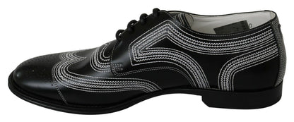 Chaussures habillées en cuir noir, style derby, avec lacets blancs de Dolce & Gabbana.