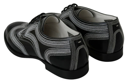 Chaussures habillées en cuir noir, style derby, avec lacets blancs de Dolce & Gabbana.