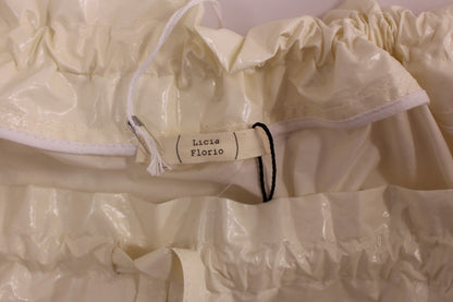 Jupe Licia Florio blanche, taille haute, extensible, avec bretelles, au-dessus du genou