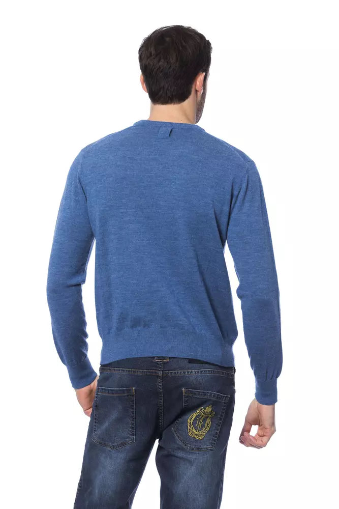 Pull en laine mérinos à col rond brodé, confectionné sur mesure par un créateur italien de renom.