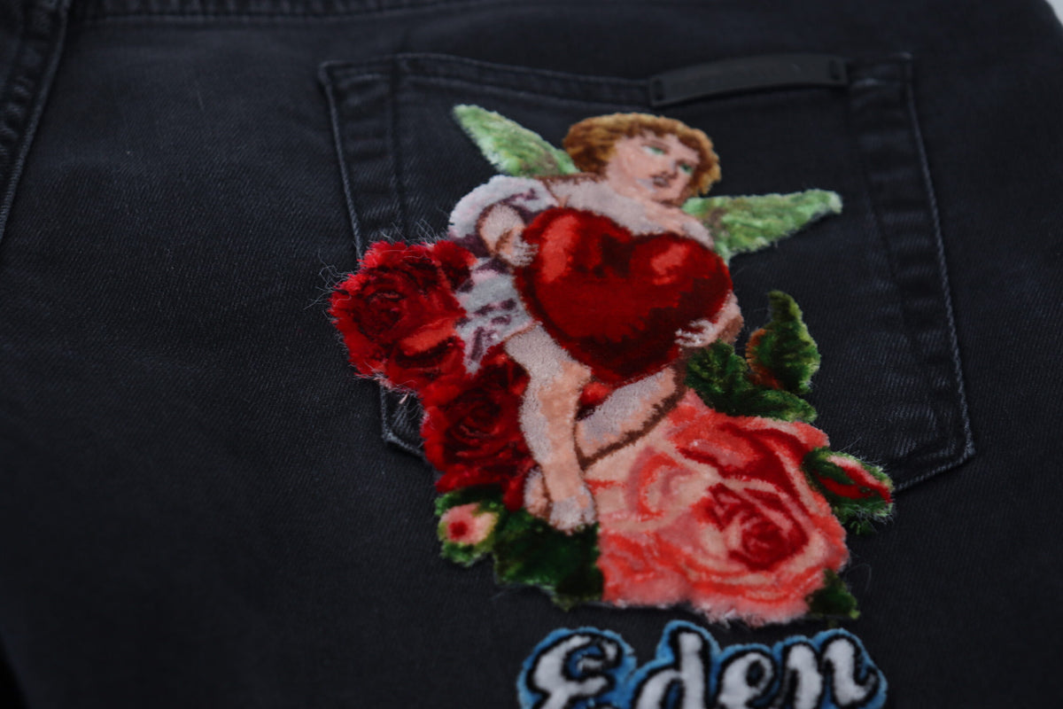 Jeans skinny en jean noir brodés d'anges de Dolce &amp; Gabbana
