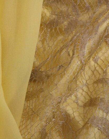 Mini-robe en dentelle jaune et strass de Dolce & Gabbana