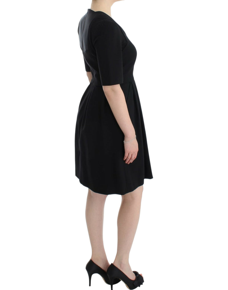 CO|TE Robe Venus noire à manches courtes